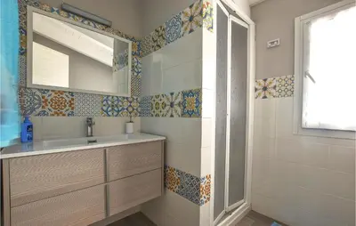a bathroom with a sink and a mirror at Awesome Home In Partinico With Wi-Fi in Partinico