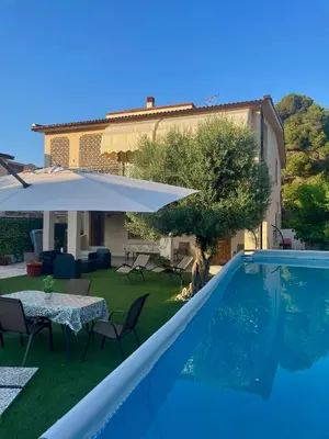 a villa with a swimming pool and a house at Villa Nasus in Carini