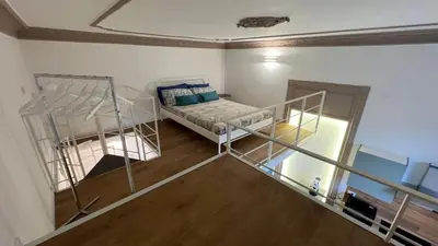 a small room with a bunk bed and a staircase at Le Stanze del Re in Palermo