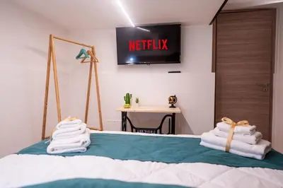 a bedroom with a bed with towels on it at Teama House - Appartamento in centro - Politeama in Palermo
