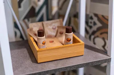 a wooden box with two bottles on a table at Teama House - Appartamento in centro - Politeama in Palermo