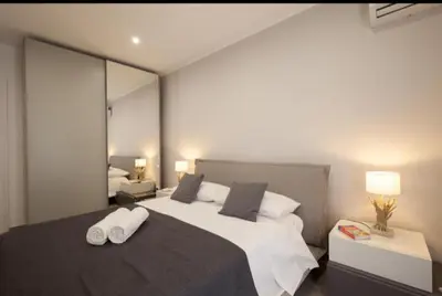 a bedroom with a large bed with two towels on it at Holiday hause Vite Aerea in Terrasini