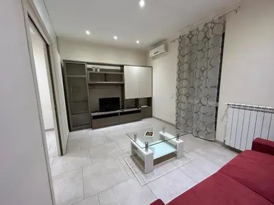 a living room with a couch and a glass table at A casa di Alli in Palermo