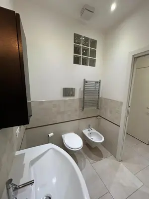 a bathroom with a tub and a toilet and a sink at A casa di Alli in Palermo