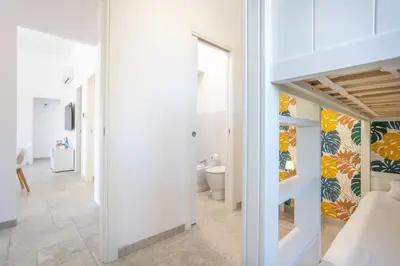 a room with a bathroom with a toilet and a sink at Villa Aurora in Balata di Baida