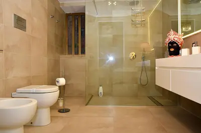 a bathroom with a shower and a toilet and a sink at Alba e i Mori in Palermo