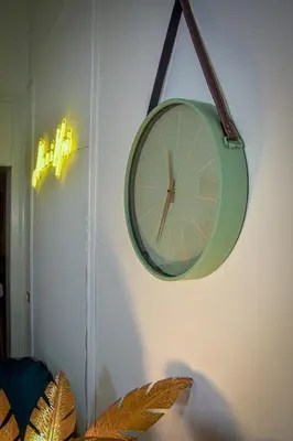 a clock is hanging on a wall at Alba e i Mori in Palermo