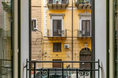 a view of a building from a window at Teatro Massimo Roomy Flat with Covered Terrace in Palermo