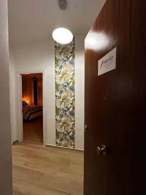 a hallway with a door leading to a bedroom at Merlo Holiday Homes Siviglia in Palermo