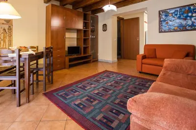 a living room with a couch and a table at Hola House allo Spasimo in Palermo