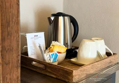 a wooden tray with a coffee pot and cups at Heritage Collection Palermo B&B in Palermo