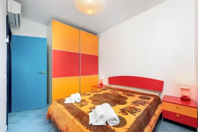 a bedroom with a bed with towels on it at Paprica&Zenzero in San Vito lo Capo