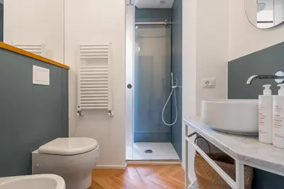a bathroom with a sink and a toilet and a shower at Casa Mirto a Piazza Marina by Wonderful Italy in Palermo