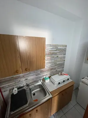 a kitchen with a sink and a counter top at Case Vacanza Trappetodavivere in Trappeto
