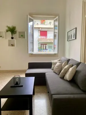 a living room with a couch and a coffee table at Urban poet retreat - casa di vincenzo e andrea 2 in Palermo
