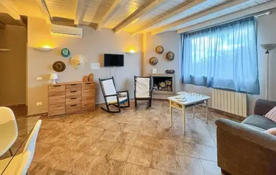 a living room with a couch and a table at Beautiful Home In Altavilla Milicia in Altavilla Milicia