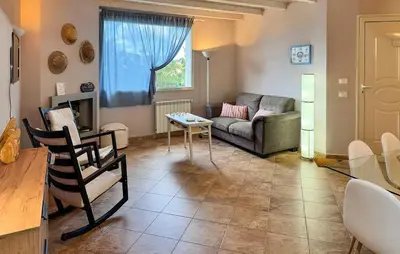 a living room with a couch and a table at Beautiful Home In Altavilla Milicia in Altavilla Milicia