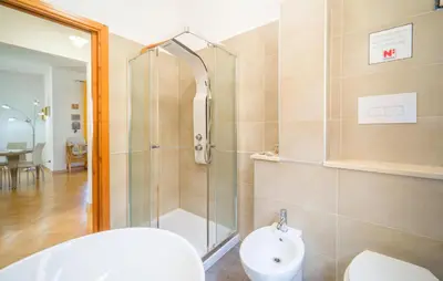 a bathroom with a shower and a toilet and a sink at 2 Bedroom Amazing Home In Trabia in Trabia