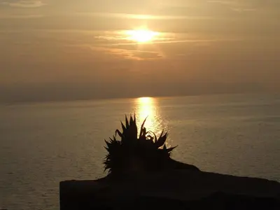 a sunset over the ocean with the sun in the sky at Casa Vacanze Karol in Trappeto