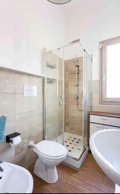 a bathroom with a shower and a toilet and a sink at Appartamento nel centro storico di Palermo in Palermo