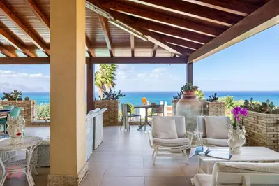 a patio with a view of the ocean at Villa vista mare e piscina privata ad Alcamo in Alcamo