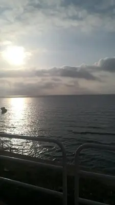a view of the ocean with a boat in the water at Holiday House Vitruvian in Terrasini