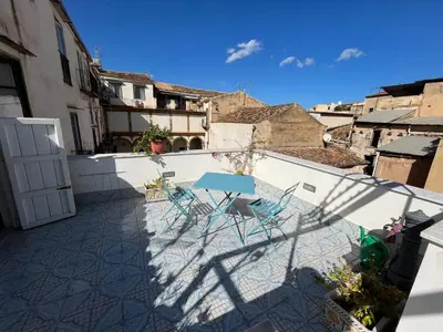 a patio with chairs and a table on a balcony at Casa Vacanze Flavia in Palermo