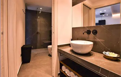 a bathroom with a sink and a toilet and a shower at 2 Bedroom Awesome Apartment In Trappeto in Trappeto