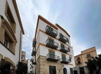 a tall building with balconies on the side of it at Giglio luxury apartment in casa professa in Palermo