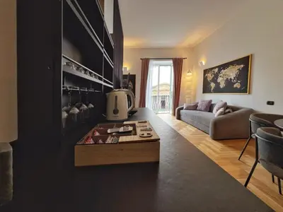 a living room with a couch and a table at Giglio luxury apartment in casa professa in Palermo