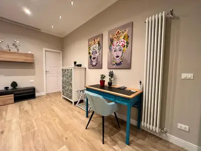 a home office with a blue desk in a room at Florio House in Palermo