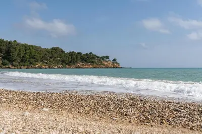 a rocky beach with the ocean in the background at Casa gli Oleandri in Castellammare del Golfo