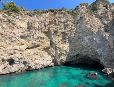 a cave in the side of a rocky cliff at Villa sole Sicily in Terrasini