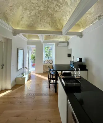 a kitchen with a table and a counter top at Valverde Home in Palermo