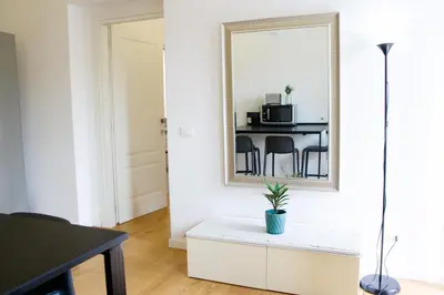 a living room with a mirror and a table at Valverde Home in Palermo
