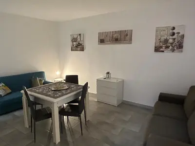a living room with a table and a couch at Ciccio's House in Palermo
