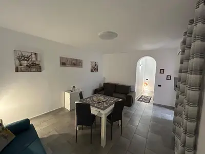 a living room with a table and a couch at Ciccio's House in Palermo