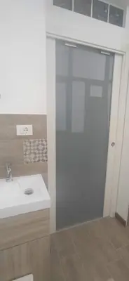 a bathroom with a white sink and a toilet at Palermo case vacanza in Palermo