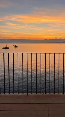 a view of the ocean with boats in the water at Studio Anatólio in Castellammare del Golfo