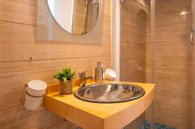 a bathroom with a sink and a mirror at Studio Anatólio in Castellammare del Golfo