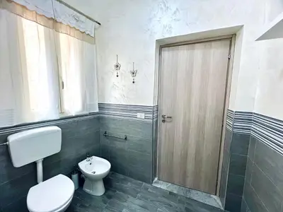 a bathroom with a toilet and a shower at Casa Nonna Anna in Palermo