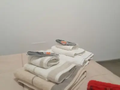 a stack of towels on a table in a bathroom at Al Cortile del capo in Palermo