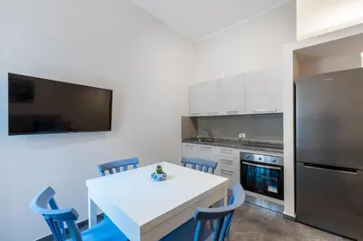 a living room with a couch and a table at Palazzo Falcone Apartments in Palermo