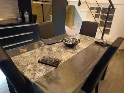 a table with a bowl of candy on top of it at Lannari 176 Casa vacanze Bagheria in Bagheria
