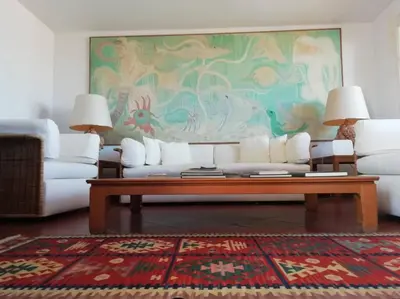 a living room with a couch and a table at Relaxing seahouse in Santa Flavia