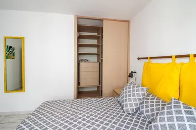 a bedroom with a bed and a closet at Appartamento del centro CIR 19081005C217988 in Castellammare del Golfo
