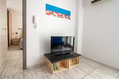 a tv sitting on a table in a room at Appartamento del centro CIR 19081005C217988 in Castellammare del Golfo