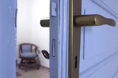an open door with a chair in a room at Appartamento della macina CIR 19081005C212931 in Castellammare del Golfo
