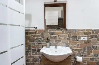 a bathroom with a sink and a mirror at Quattro canti apartment Palermo centro storico in Palermo