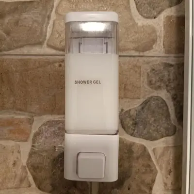 a synergy cell phone sitting on a stone wall at Quattro canti apartment Palermo centro storico in Palermo